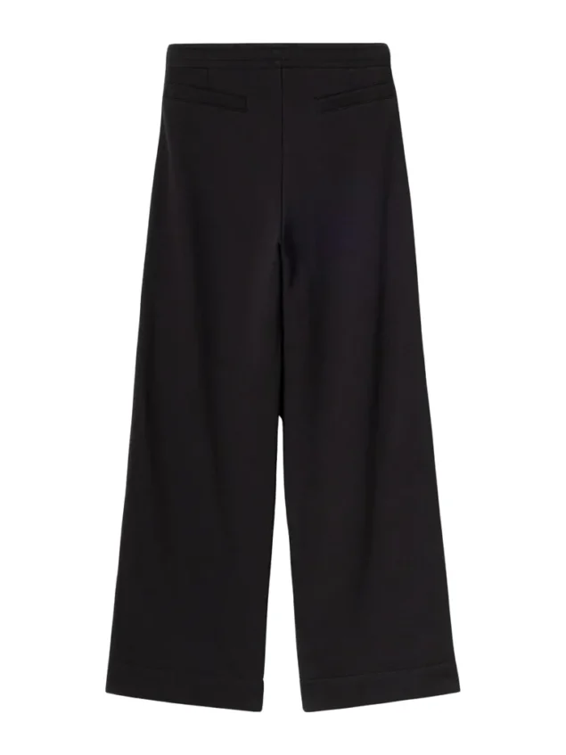 Mademoiselle YéYé Regenbogen Sweathose aus Bio-Baumwolle Rainbow Vibe Trousers Farbe/Muster: Black Entspannte Hose im Tracksuit Style. Mit der passenden Jacke = Grande Amore! Natürlich sind alle Farben im Regenbogen auch in der Kollektion zu finden. Also kombiniere die Hose mit unseren uni Tops und Shirts. Nachhaltig und zertifiziert Weiches Sweat-Material Langes, gerades Bein Abgesteppte Biese vorne Gummibund Seitliche Eingriffstaschen Leistentaschen hinten Regenbogenband auf den Seitennähten 100% Baumwolle (organic)